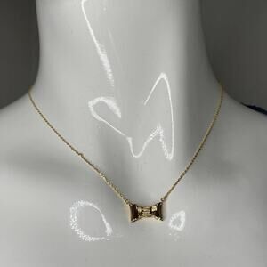 Kate Spade all wrapped up mini pendant Gold Tone Necklace